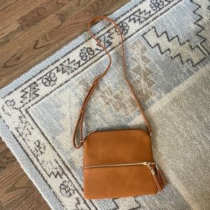 Never used!!! Cute camel crossbody with gold details and striped lining.